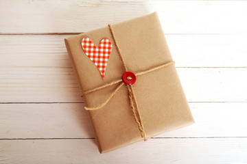 Beautiful gift box on wooden table. Valentine Day concept