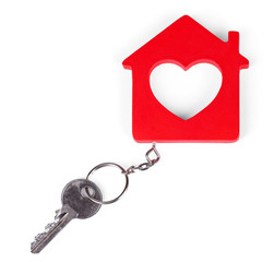 Toy house with key isolated on white