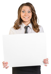 Naklejka premium Joyful young girl holding a blank poster.
