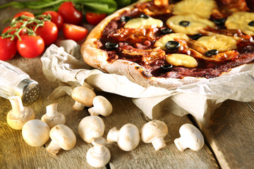 Tasty pizza with vegetables on table close up