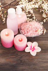 Spa still life with flowering branches on wooden background