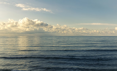 Landscape view of beautiful deep blue sea with clouds
