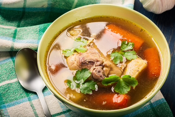 Chicken broth with noodles and carrot
