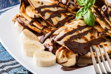 Crepes with banana and chocolate cream