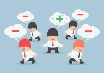 Think positive businessman surrounded by negative thinking peopl