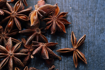 Star anise seeds on the wooden background