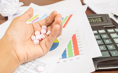 Pills on woman hand