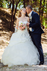 Bride and Groom at wedding Day walking Outdoors on spring nature