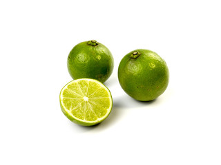 Obraz na płótnie Canvas Green limes on white background