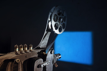 Film projector projecting a movie on the wall