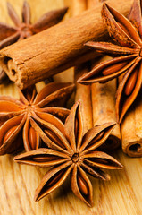 cinnamon and anise on the wooden background