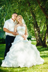 Bride and Groom at wedding Day walking Outdoors on spring nature