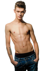 Fototapeta premium A young man with a beautiful physique.