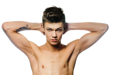 Fototapeta premium A young man with a beautiful physique.