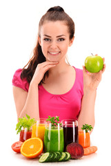 Young woman with variety of vegetable and fruit juices