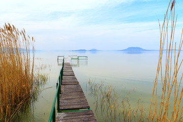 Fototapeta na wymiar Wooden pier in tranquil lake Balaton