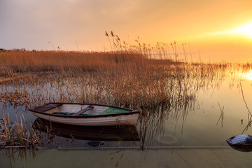 Sunset on the lake Balaton with a boat