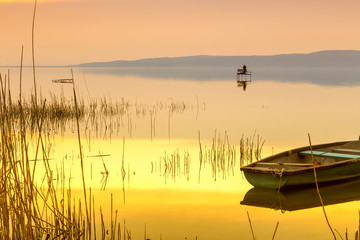 Sunset on the lake Balaton with a boat