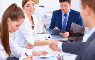 Business people shaking hands, finishing up a meeting