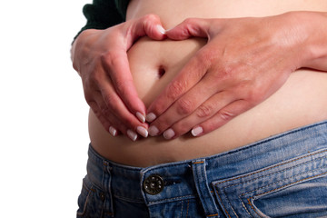 Fototapeta premium Herzform auf dem Schwangeren Bauch