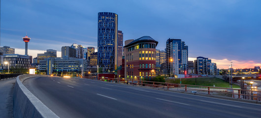 Calgary skyline at night with Bow River and freeway. - obrazy, fototapety, plakaty