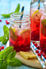 Cold redcurrant tea with lemon and mint. © lilechka75