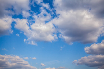 Blue sky with clouds and sun.