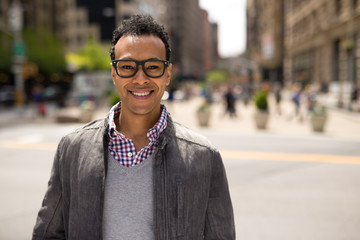 Young African Asian man in New York City smile face portrait