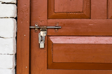 Basic latch and padlock at Nepal trek trail guest rooms