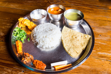 Nepali Thali meal set with chicken curry