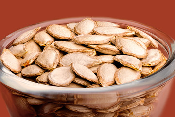 Closeup of delicious pumpkin seeds in a glass bowl