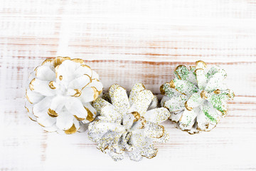 white cones on white wooden background