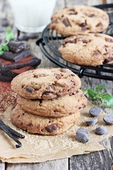  Chocolate cookies with chocolate chips on a rustic wooden table