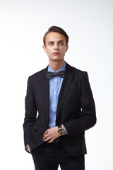 young handsome man in elegant suit with butterfly