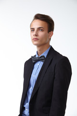 young handsome man in elegant suit with butterfly