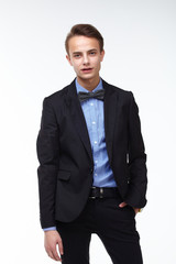 young handsome man in elegant suit with butterfly