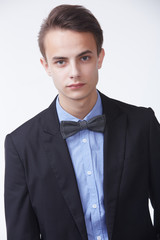 young handsome man in elegant suit with butterfly