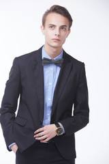 young handsome man in elegant suit with butterfly