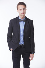 young handsome man in elegant suit with butterfly