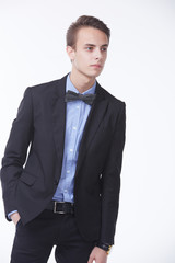 young handsome man in elegant suit with butterfly