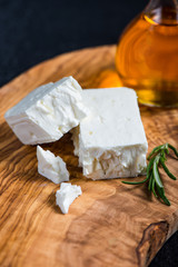 Feta cheese on wooden board