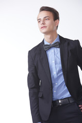 young handsome man in elegant suit with butterfly