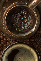 Fresh coffee in coffee pot and cup (top view)