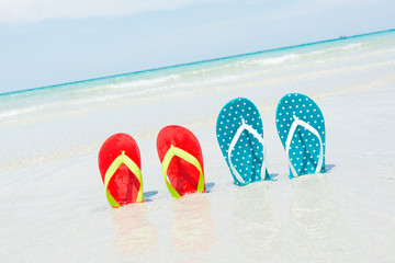Naklejka premium Beach, slippers on tropical beach