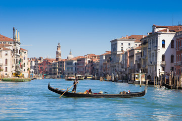 Fototapeta na wymiar Venice, Italy - March 28, 2015: Gondolier on grand canal