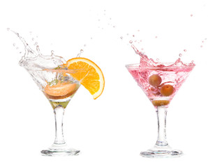 Splash from olive in a glass of cocktail, isolated on  white 