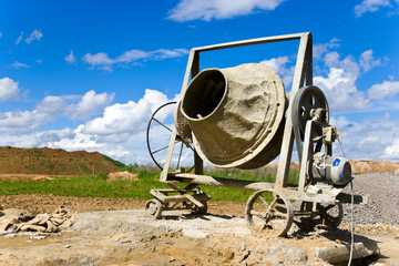 Obraz na płótnie Canvas Concrete mixer machine on construction site