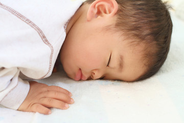Obraz na płótnie Canvas 幼児(1歳児)の寝顔