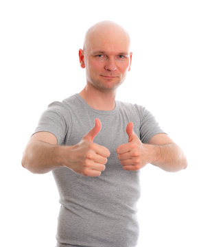 Man With Bald Head And Thumbs Up Is Looking Friendly In To The C