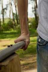 Man"s hand on the bars. Sport in your life